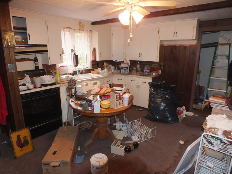 Dark, cluttered kitchen before. - CT Properties Southcoast